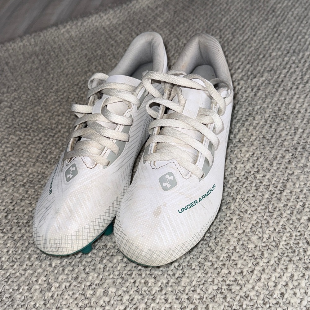 Under Armour Kids White Cleats with Green Accents